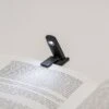 KIKKERLAND Mini Folding Book Light -Kikkerland BL11 actionshot 2 1