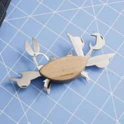 KIKKERLAND Multi Tool In A Crab Design - Mini Scissor - Bottle Opener - Rope 12 KIKKERLAND Multi Tool In A Crab Design - Mini Scissor - Bottle Opener - Rope -Kikkerland CD114 Crab Multitool ACTION 0761 square