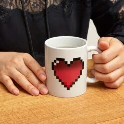 KIKKERLAND Morph Coffee Mug Heart -Kikkerland CU44 MORPH MUG PIXEL HEART ACTION